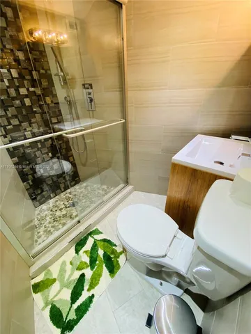 a bathroom with a toilet and a sink