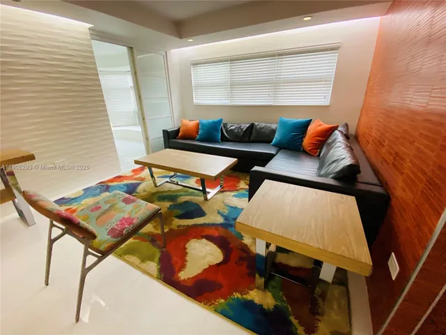 a living room with furniture and rug