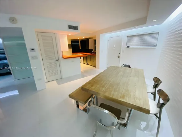 a room with pool table and flat screen tv