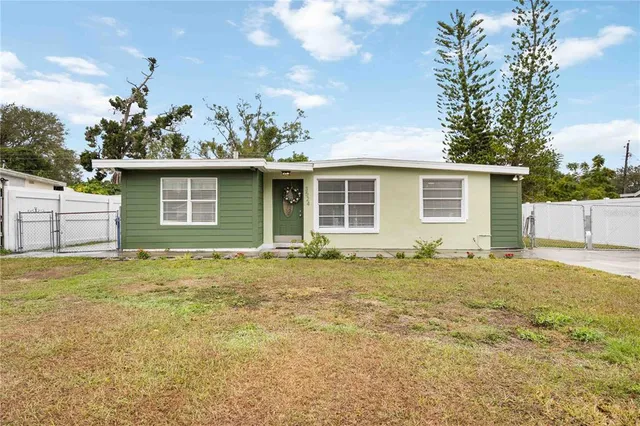 a house view with a backyard space