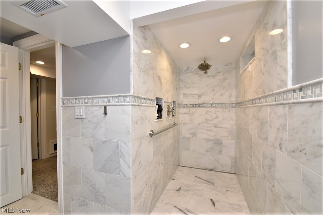 8790 Avery Road Broadview Heights, OH 44147 - Photo 28 of 35 The zero entry open shower provides a luxury feel right at home or the perfect place to bath your four legged family members after racing around the backyard!