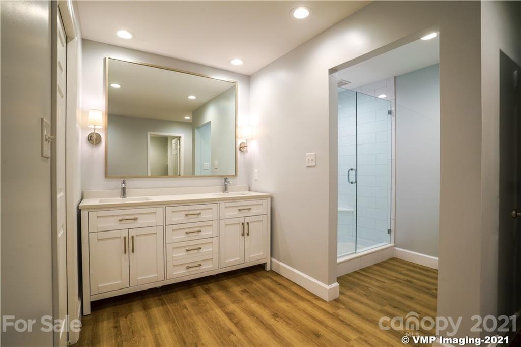 119 Friendfield Drive Fort Mill, SC 29715 - Photo 13 of 24 a spacious bathroom with a shower a sink and a mirror