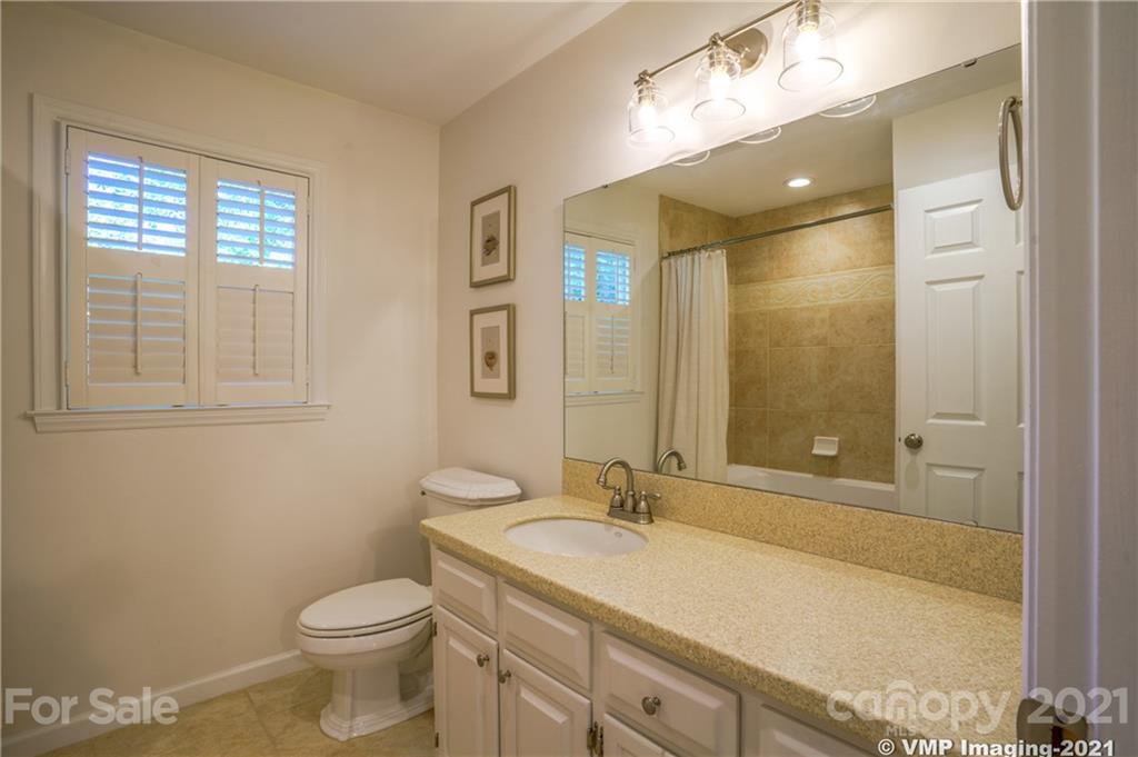 119 Friendfield Drive Fort Mill, SC 29715 - Photo 15 of 24 a bathroom with a granite countertop sink toilet and shower