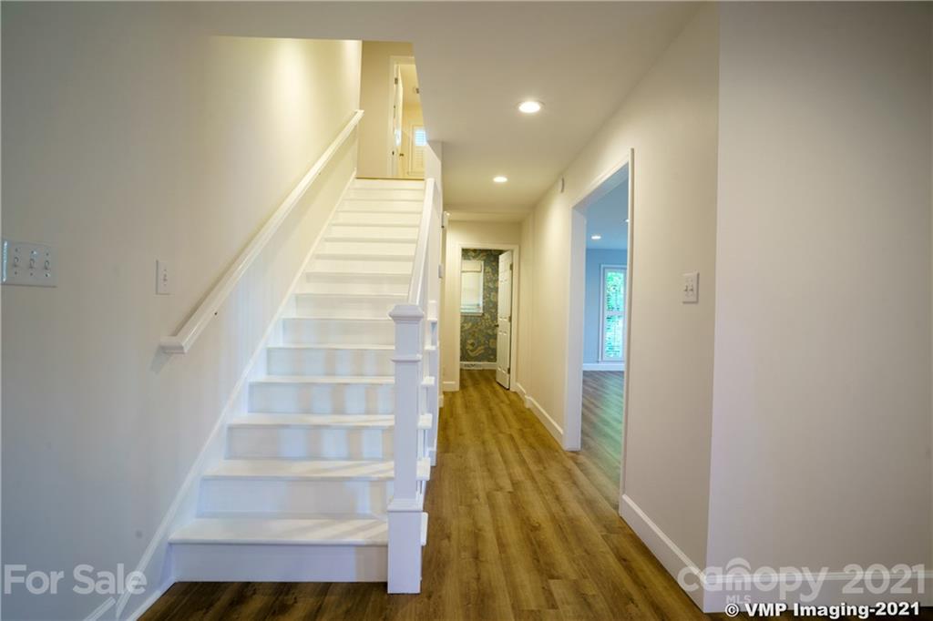 119 Friendfield Drive Fort Mill, SC 29715 - Photo 7 of 24 a view of entryway and hall with wooden floor