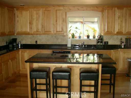 26436 Apache Lake Rimforest, CA 92378 - Photo 2 of 7 a kitchen with a table and chairs in it
