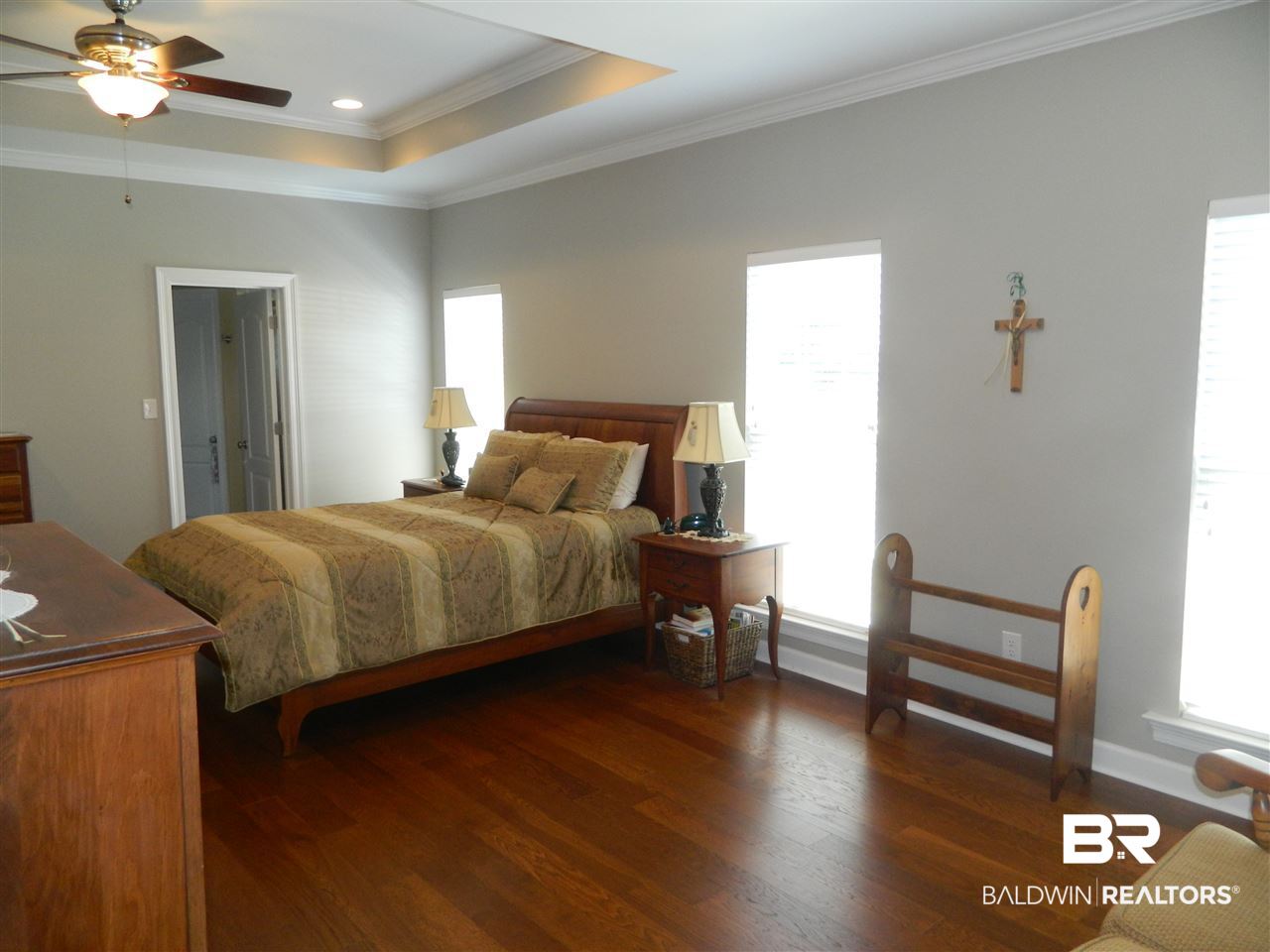 3990 Symphony Way West Semmes, AL 36575 - Photo 18 of 45 Large master bedroom with hardwood flooring.