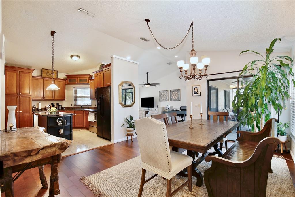 300 Springview Drive Sanford, FL 32773 - Photo 11 of 55 a view of a dining room with furniture and wooden floor