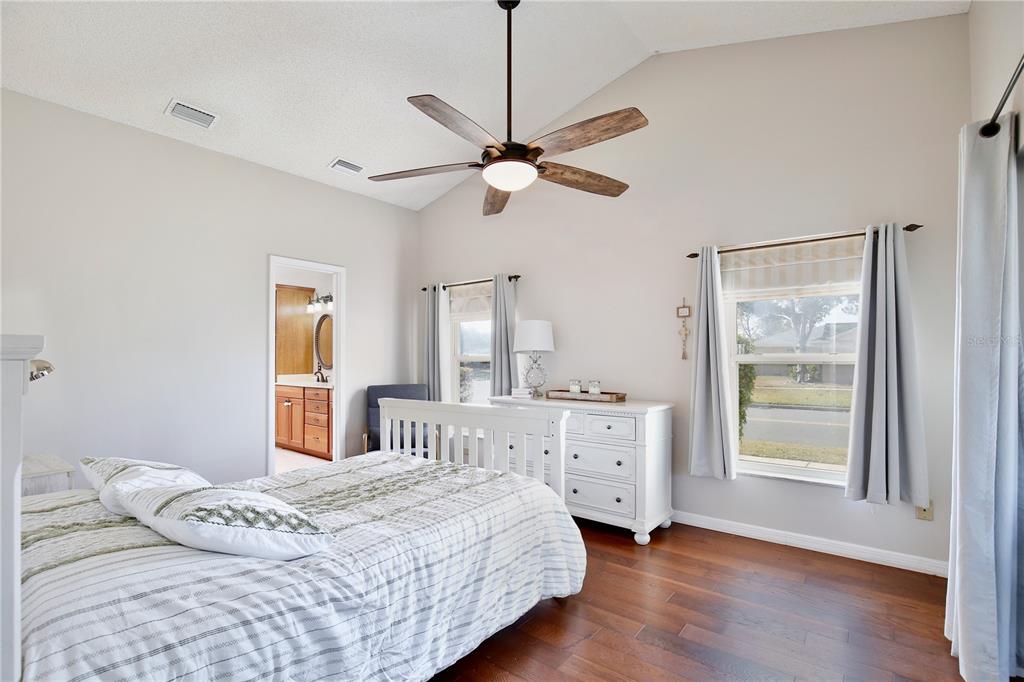 300 Springview Drive Sanford, FL 32773 - Photo 15 of 55 a bedroom with a bed chandelier and a window