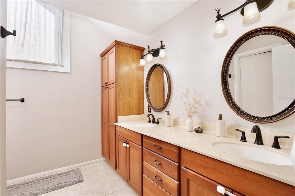 300 Springview Drive Sanford, FL 32773 - Photo 17 of 55 a bathroom with a sink and a mirror