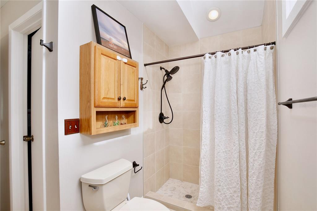 300 Springview Drive Sanford, FL 32773 - Photo 18 of 55 a bathroom with a shower toilet and sink