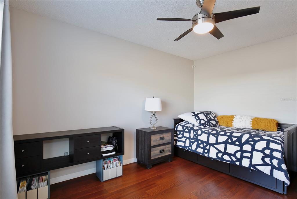 300 Springview Drive Sanford, FL 32773 - Photo 19 of 55 a bedroom with a bed and a tv