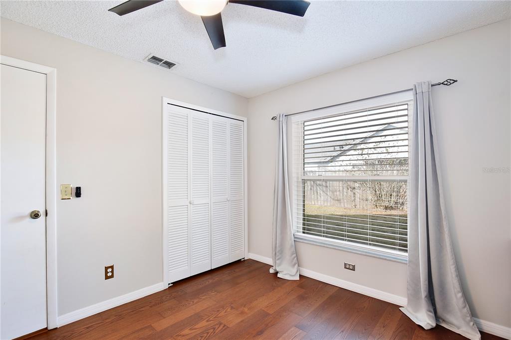 300 Springview Drive Sanford, FL 32773 - Photo 20 of 55 a view of an empty room with wooden floor and a window