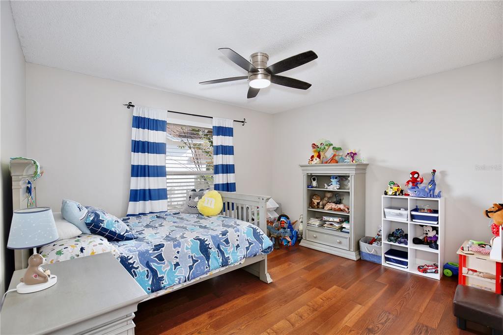 300 Springview Drive Sanford, FL 32773 - Photo 23 of 55 a bedroom with furniture and a book shelf