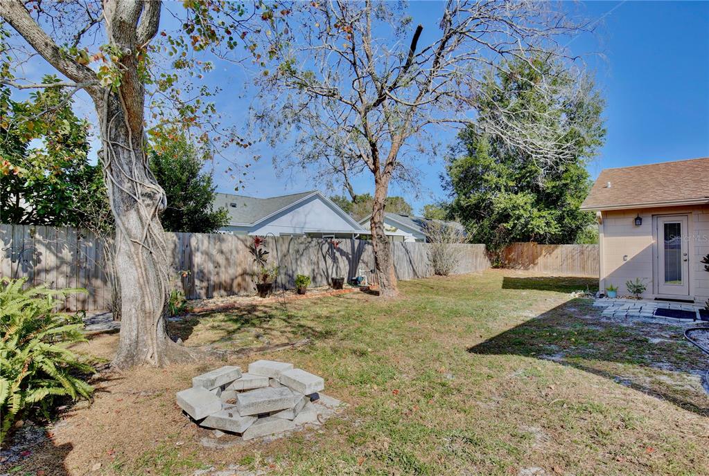 300 Springview Drive Sanford, FL 32773 - Photo 29 of 55 a backyard of a house with table and chairs