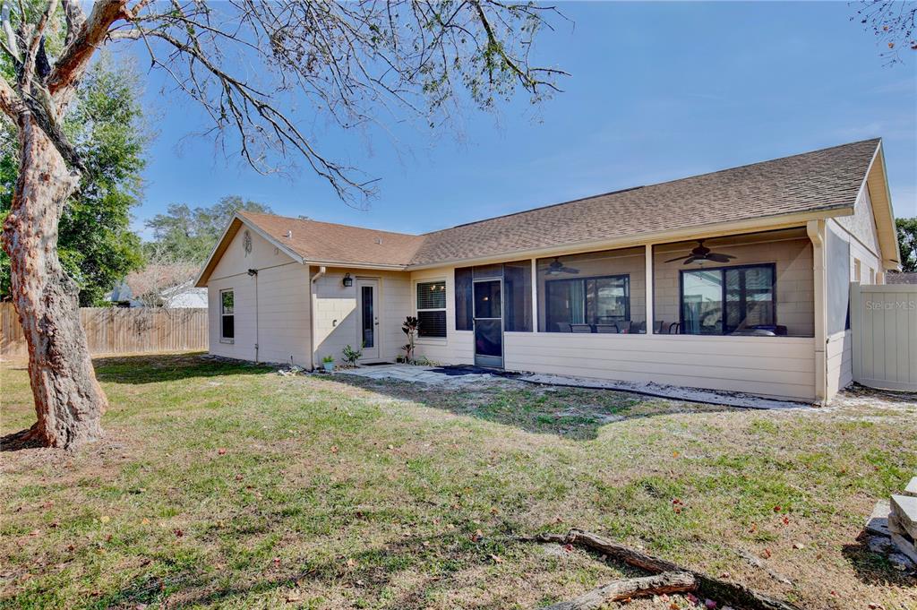 300 Springview Drive Sanford, FL 32773 - Photo 30 of 55 a view of house with backyard and a tree