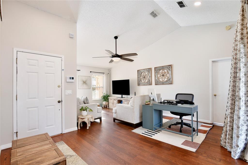300 Springview Drive Sanford, FL 32773 - Photo 6 of 55 a living room with furniture and a flat screen tv