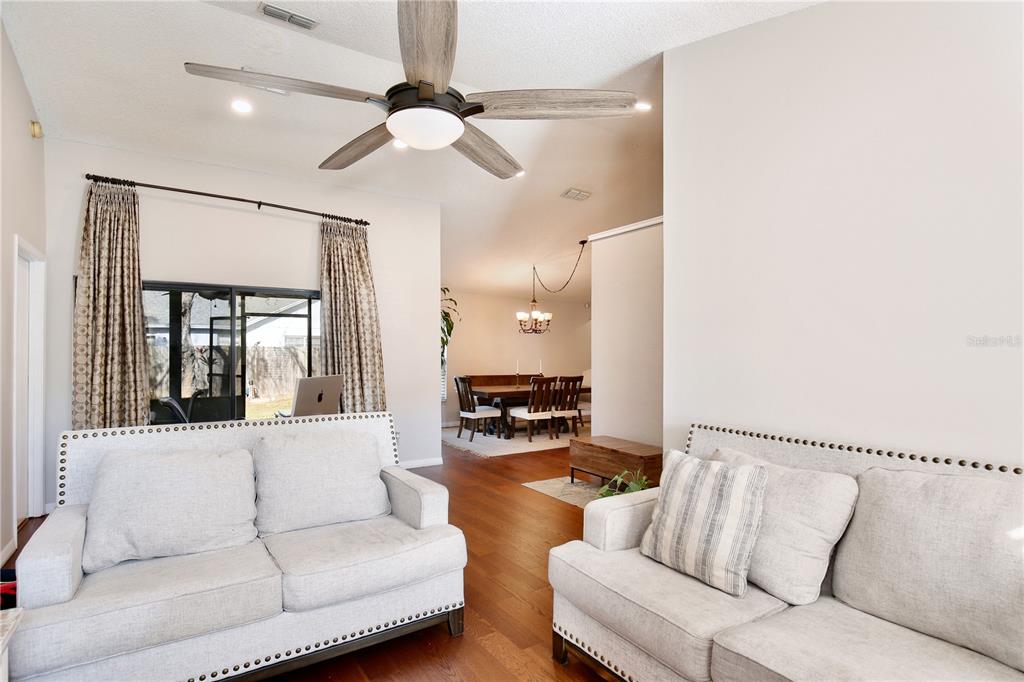 300 Springview Drive Sanford, FL 32773 - Photo 8 of 55 a living room with furniture and a large window