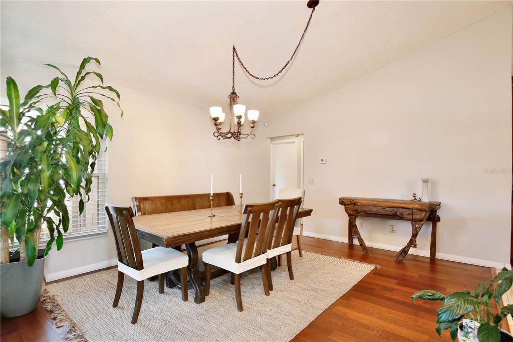 300 Springview Drive Sanford, FL 32773 - Photo 9 of 55 a view of a dining room with furniture and chandelier