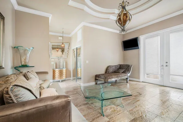 a view of a room with furniture and wooden floor