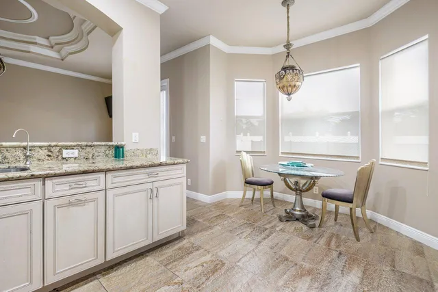 a bathroom with a sink a mirror and vanity