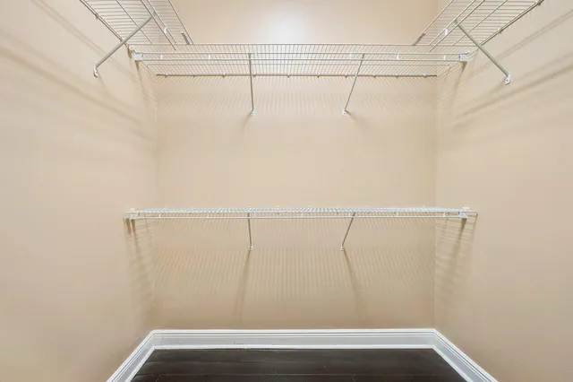 a large bathroom with a large tub sink and cabinets