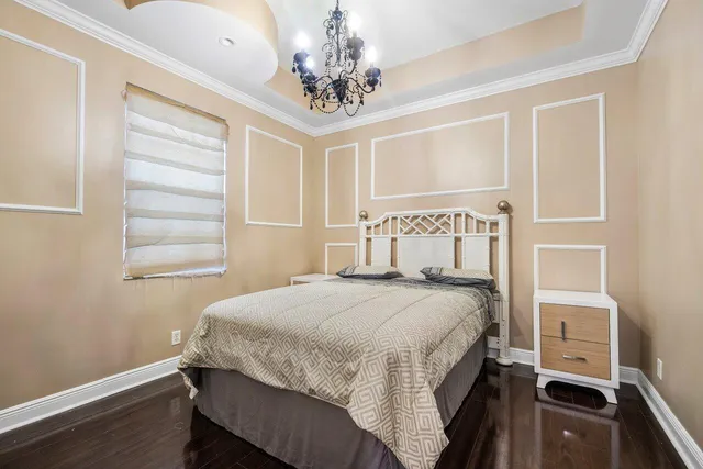 a bedroom with a bed and a night stand