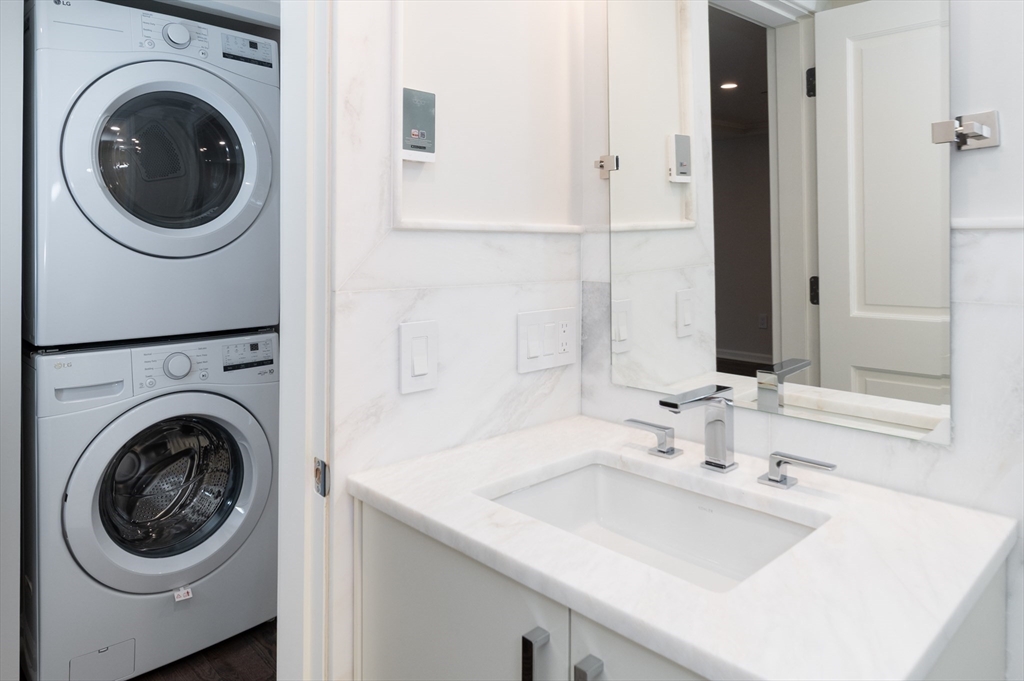 1 School Street, Unit R2 Manchester, MA 01944 - Photo 5 of 13 a utility room with sink dryer and washer