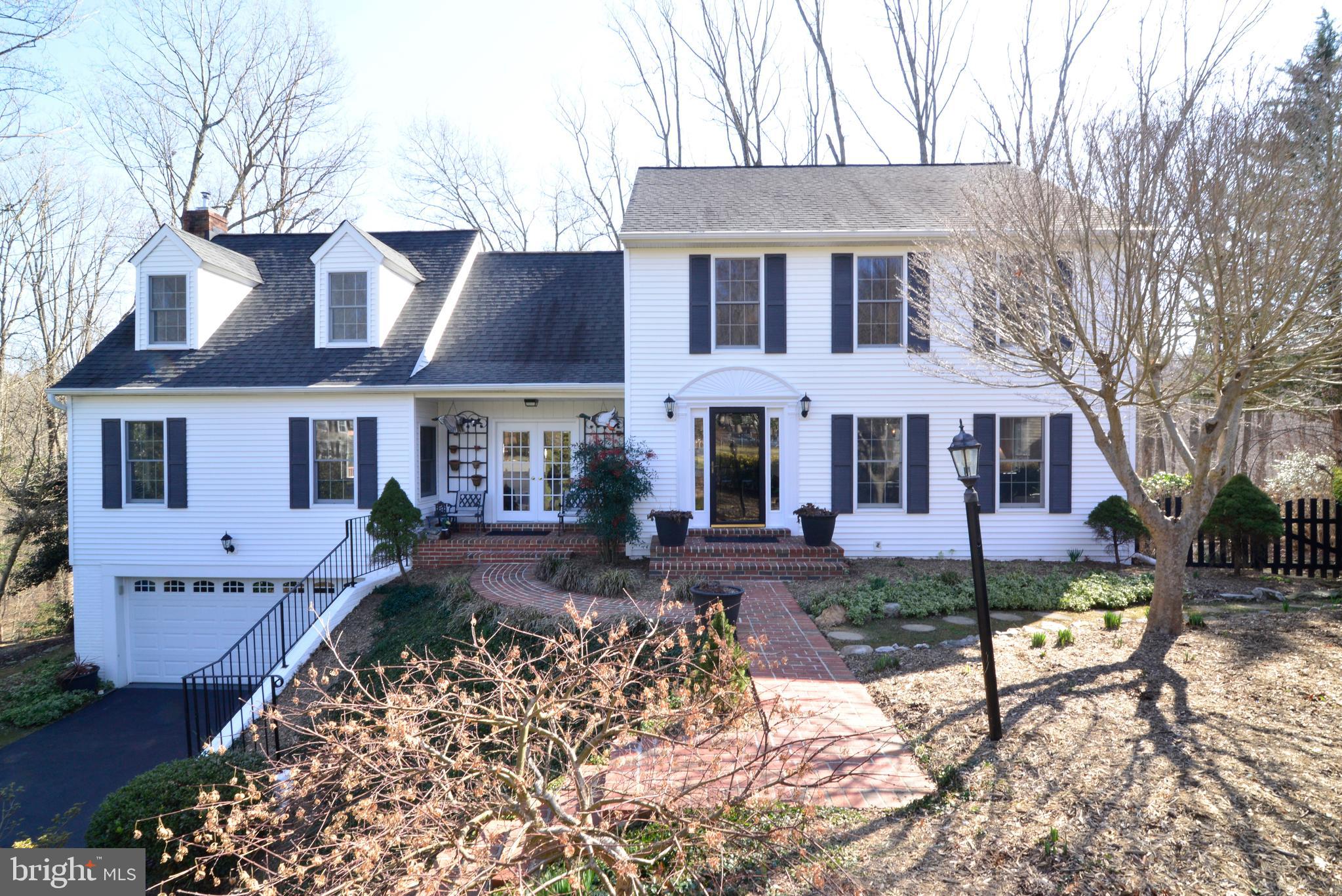 1966 Barton Hill Road Reston, VA 20191 - Photo 1 of 52 front view of a house with a yard