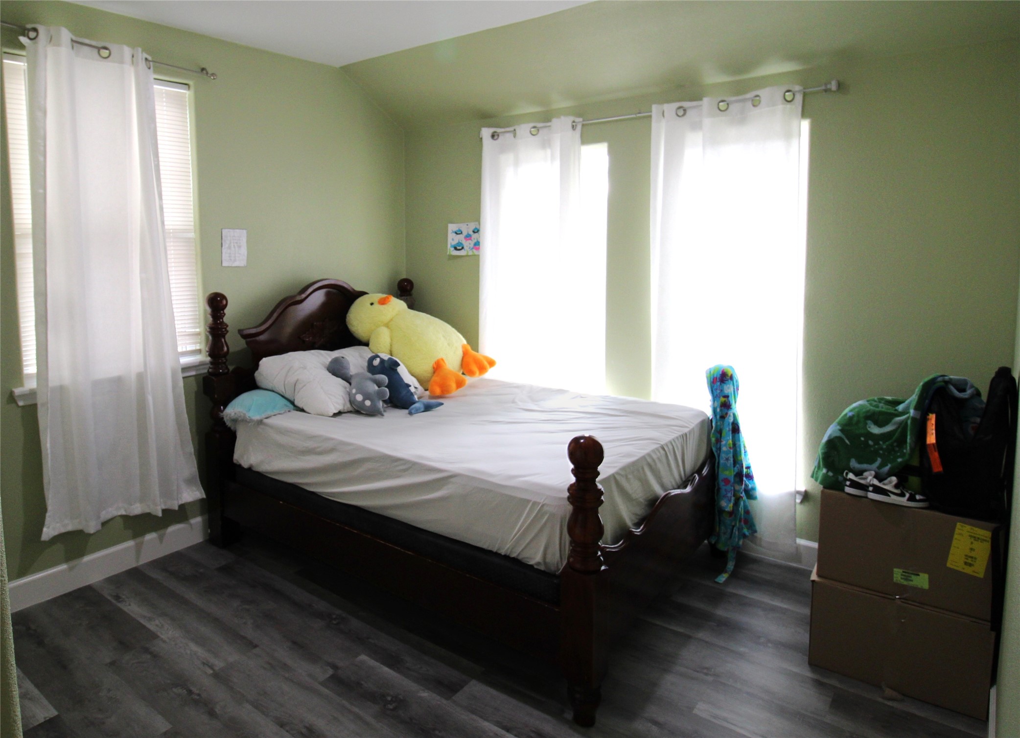 820 Railroad Avenue Shepherd, TX 77371 - Photo 17 of 29 a bedroom with a bed and wooden floor