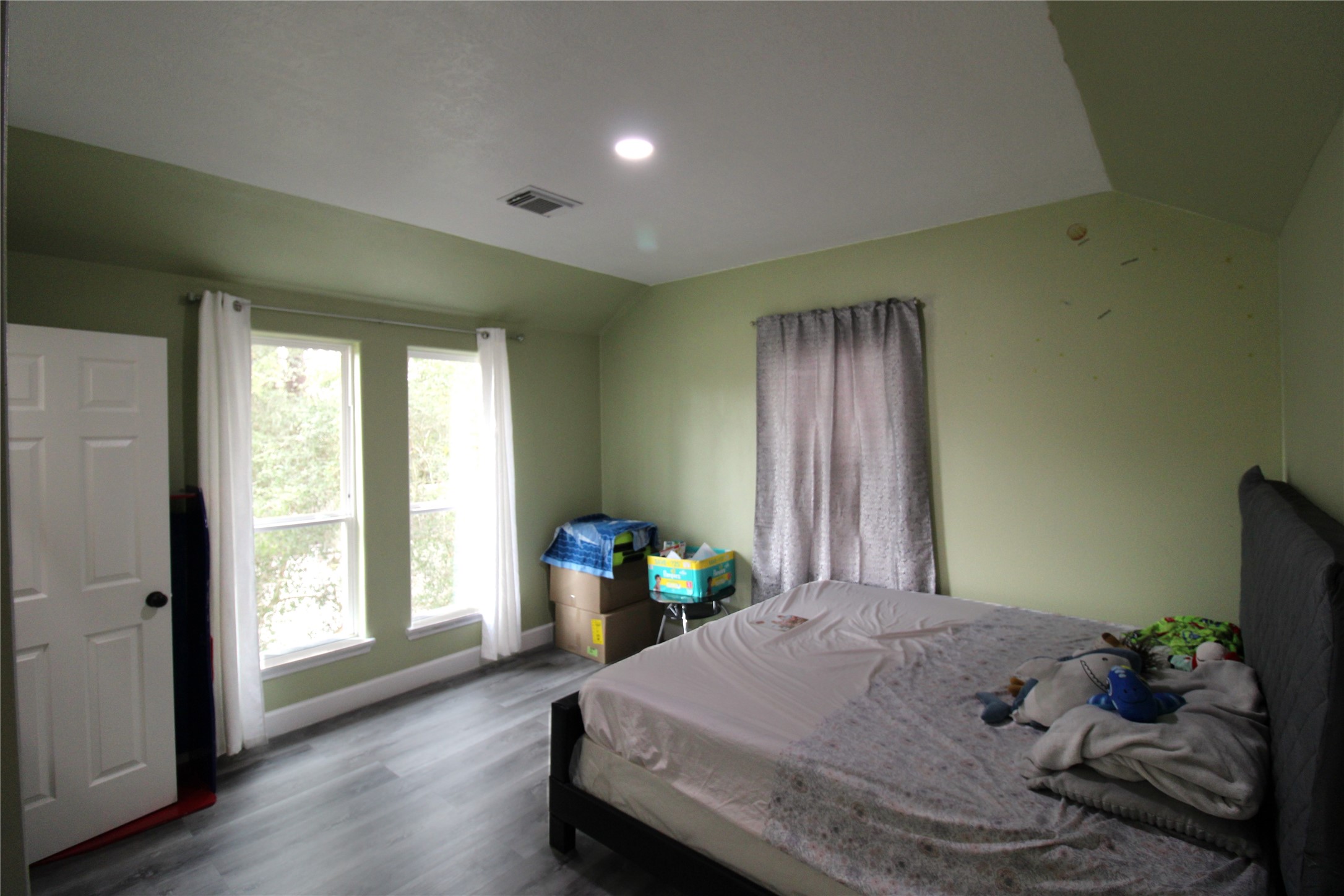 820 Railroad Avenue Shepherd, TX 77371 - Photo 20 of 29 a bedroom with a bed and wooden floor