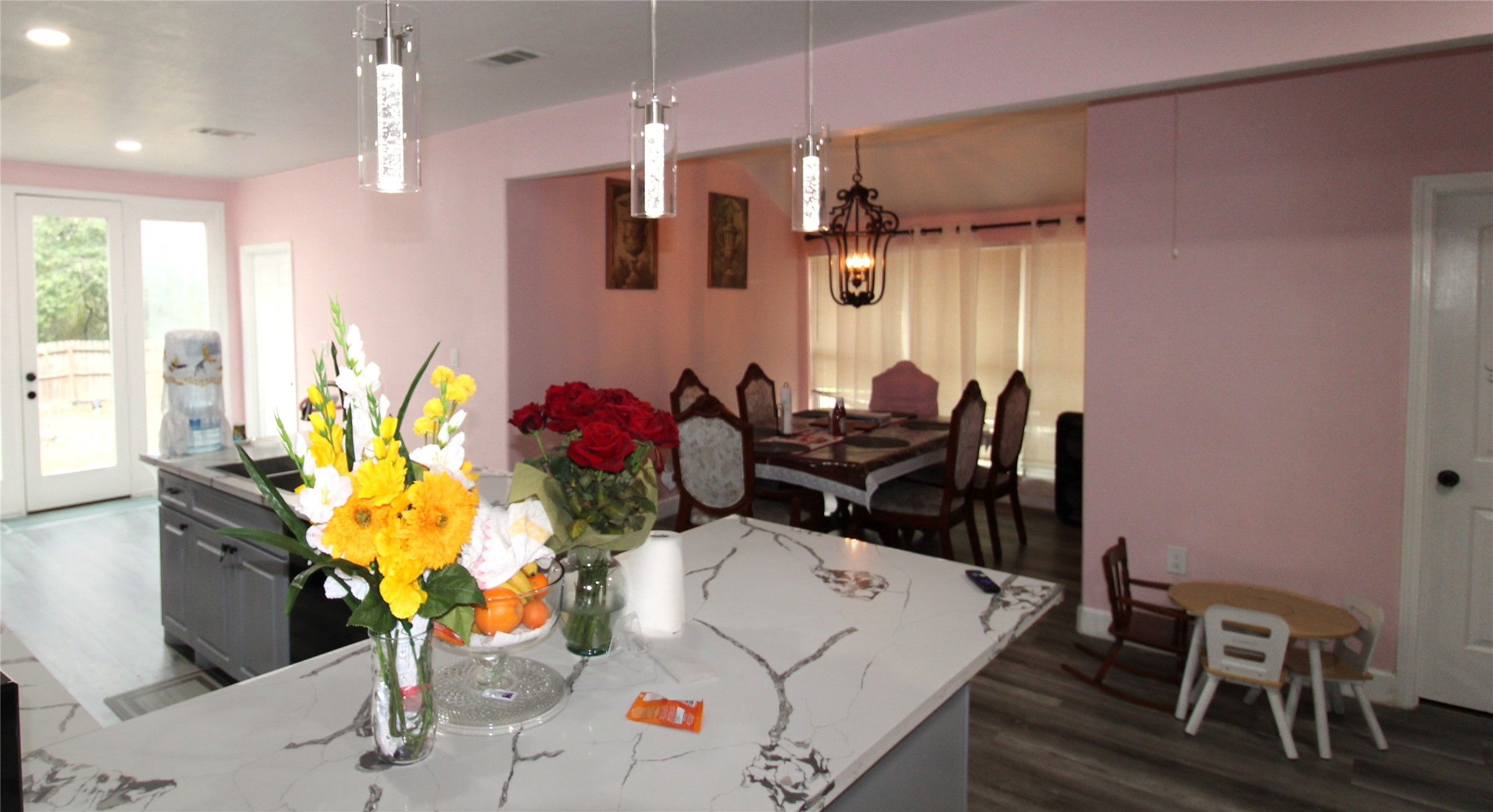 820 Railroad Avenue Shepherd, TX 77371 - Photo 23 of 29 a room with gym equipment and a chandelier