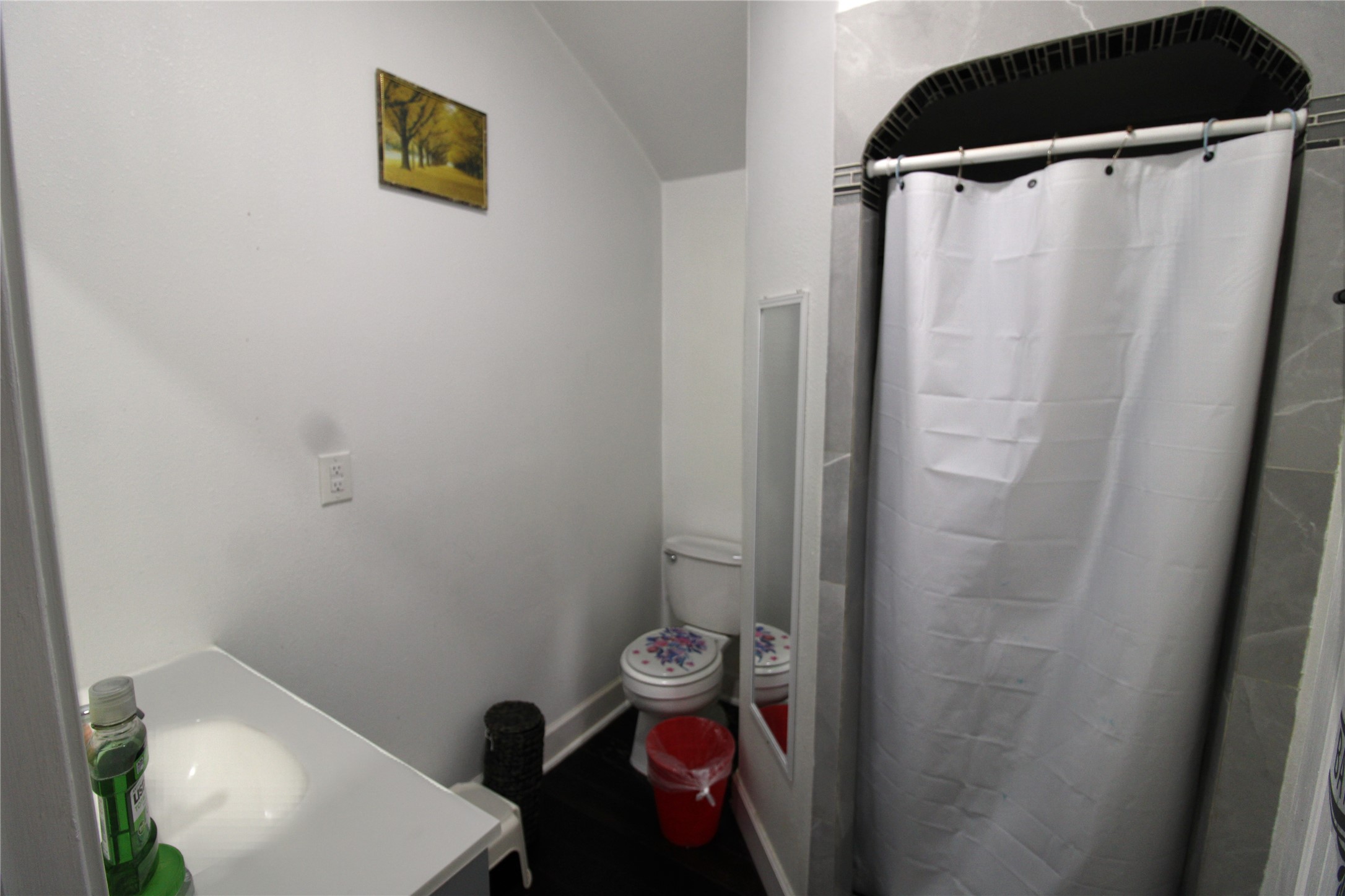 820 Railroad Avenue Shepherd, TX 77371 - Photo 25 of 29 a bathroom with a toilet and a shower curtain
