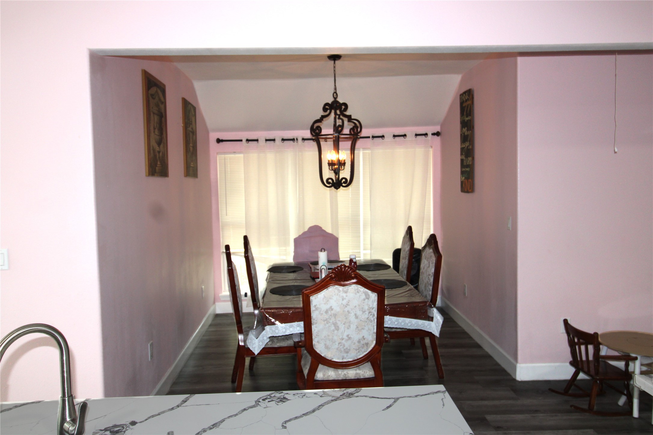 820 Railroad Avenue Shepherd, TX 77371 - Photo 9 of 29 a dining room with chandelier fan and wooden floor