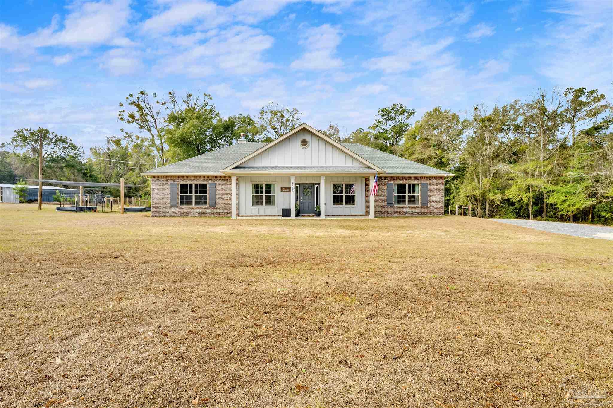 4363 Morristown Road Jay, FL 32565 - Photo 1 of 37 a front view of a house with a yard