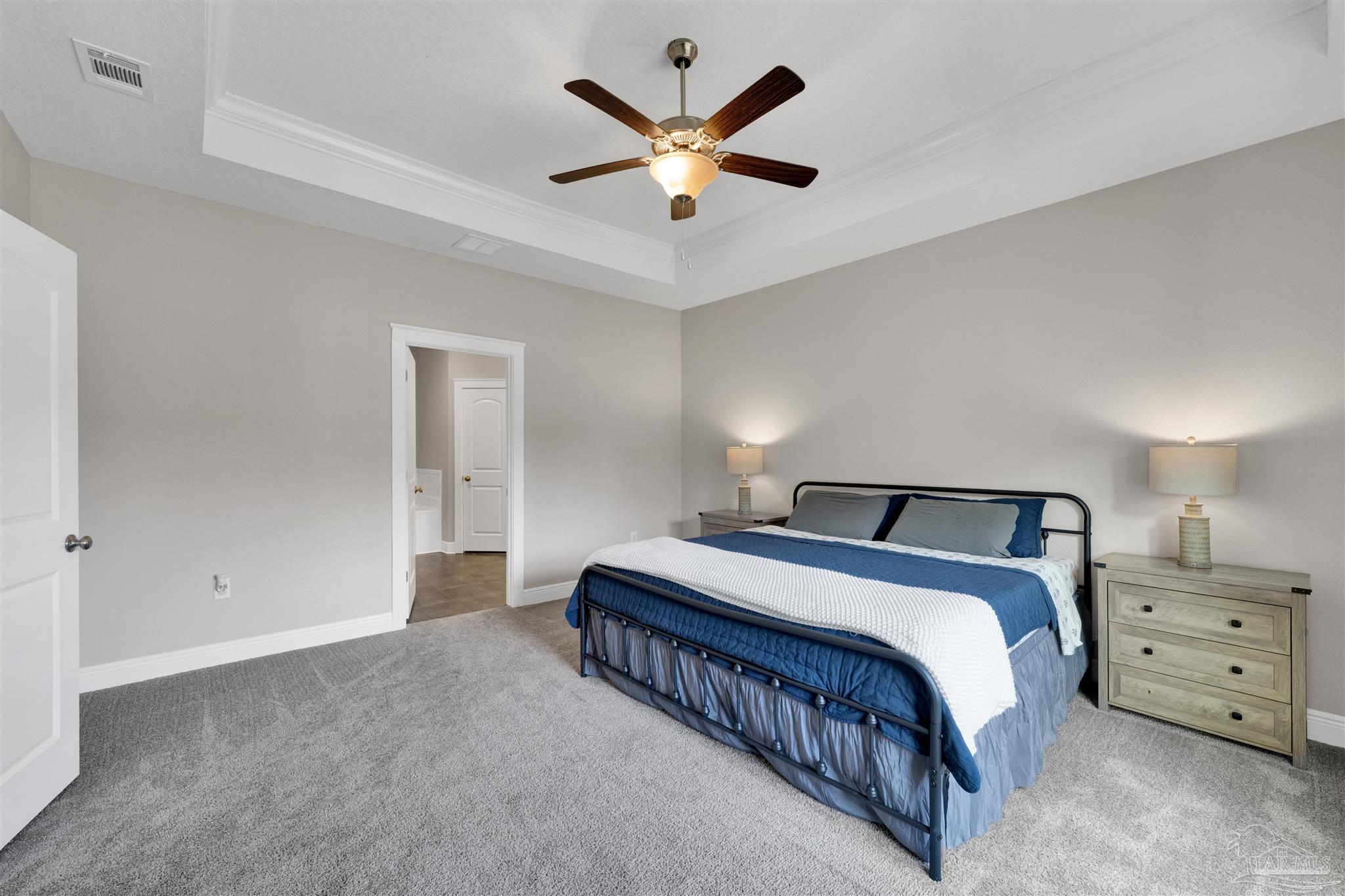 4363 Morristown Road Jay, FL 32565 - Photo 16 of 37 a spacious bedroom with a bed and a ceiling fan