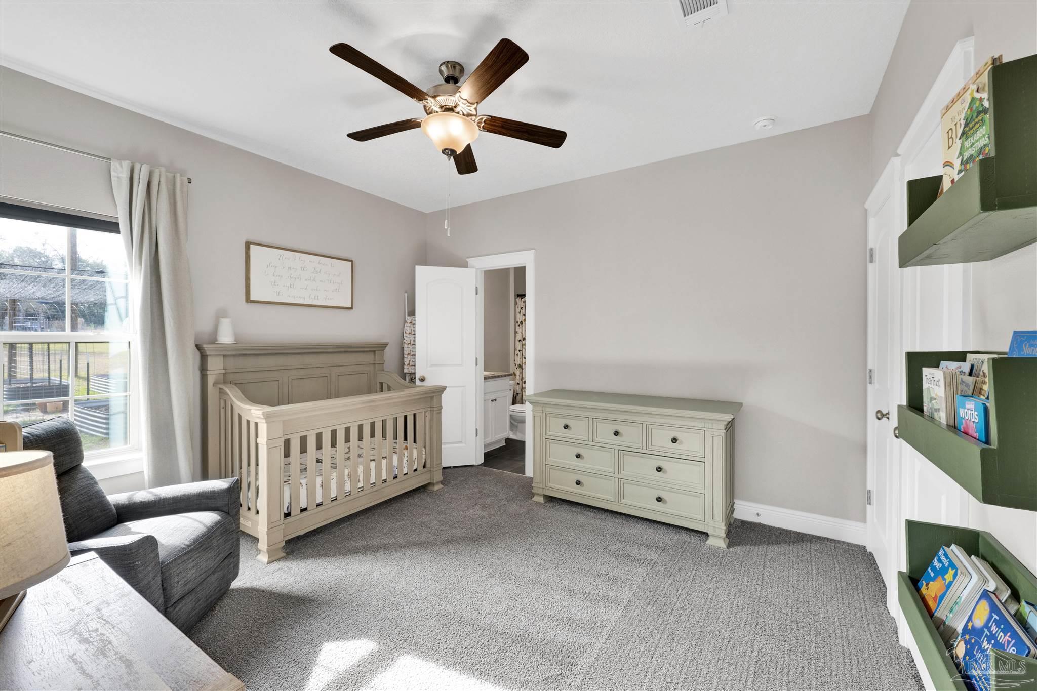 4363 Morristown Road Jay, FL 32565 - Photo 21 of 37 a view of a bedroom with furniture and windows