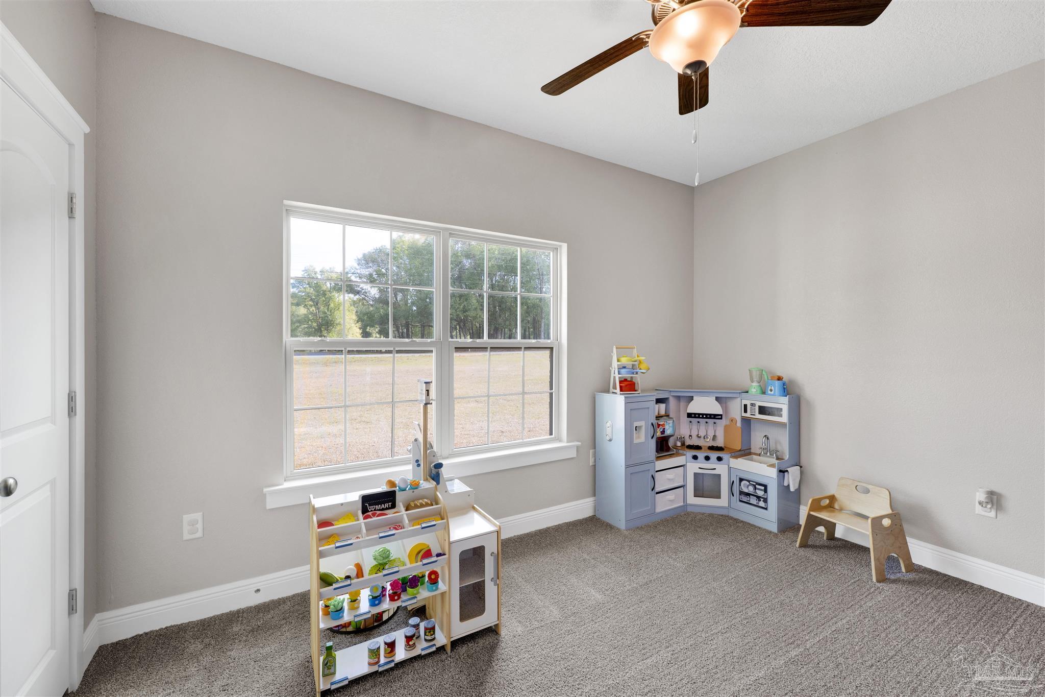 4363 Morristown Road Jay, FL 32565 - Photo 22 of 37 a children room with toys and a window