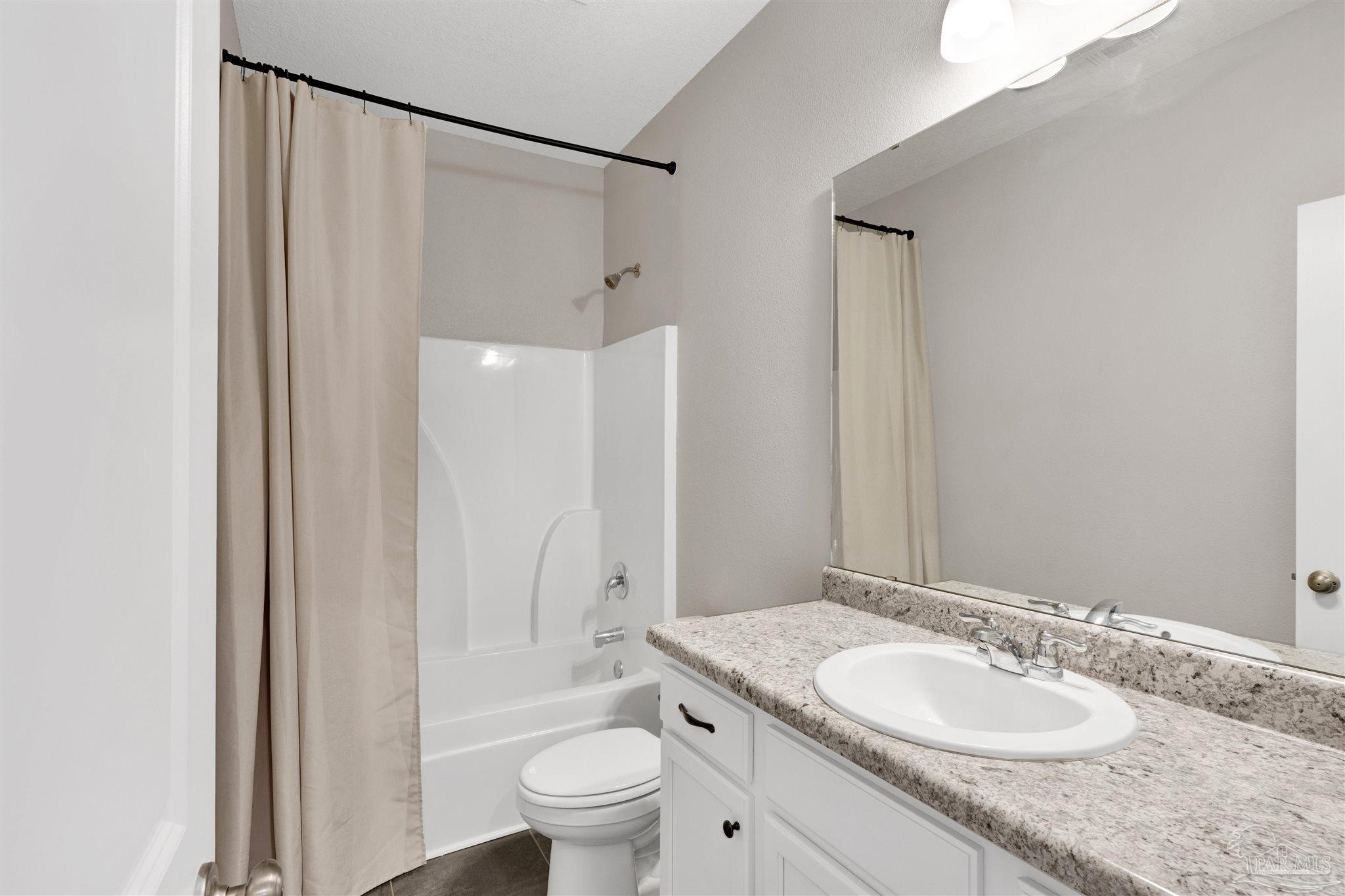 4363 Morristown Road Jay, FL 32565 - Photo 25 of 37 a bathroom with a granite countertop sink toilet and shower