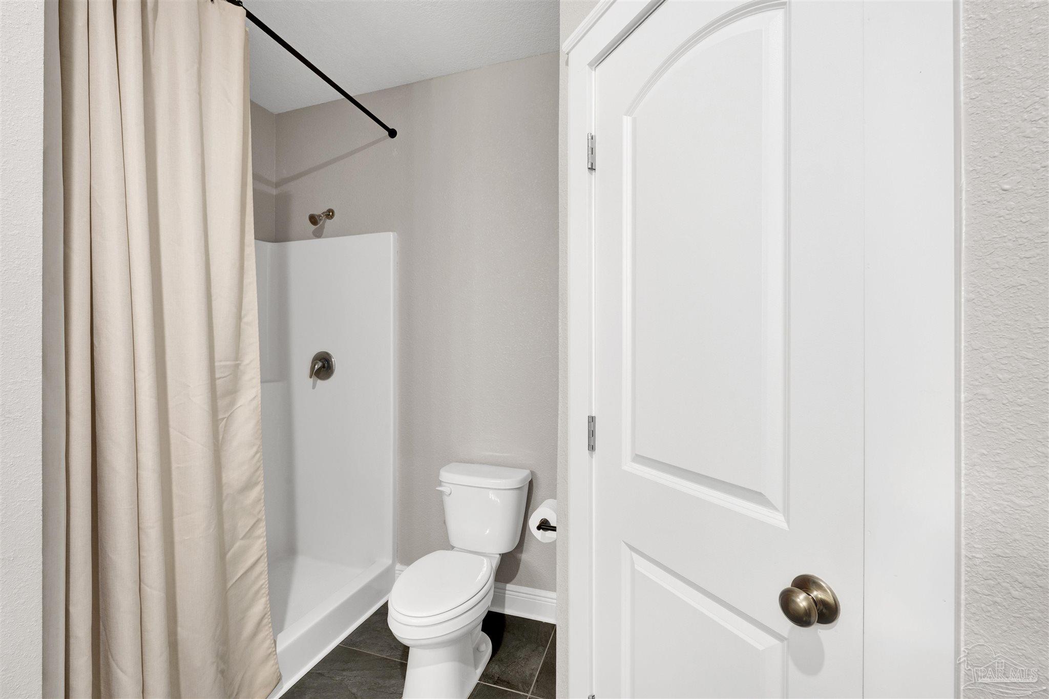 4363 Morristown Road Jay, FL 32565 - Photo 26 of 37 a bathroom with a toilet and a shower