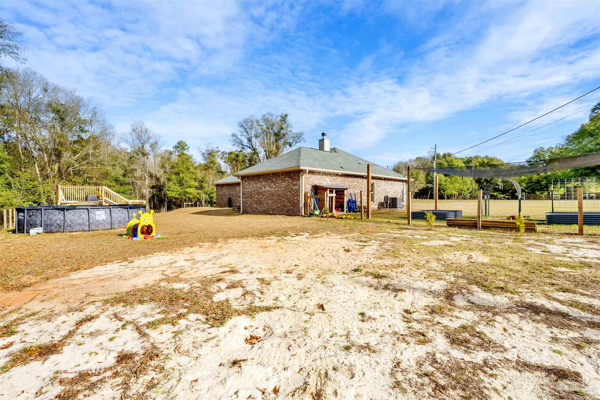 4363 Morristown Road Jay, FL 32565 - Photo 32 of 37 a view of swimming pool with a yard
