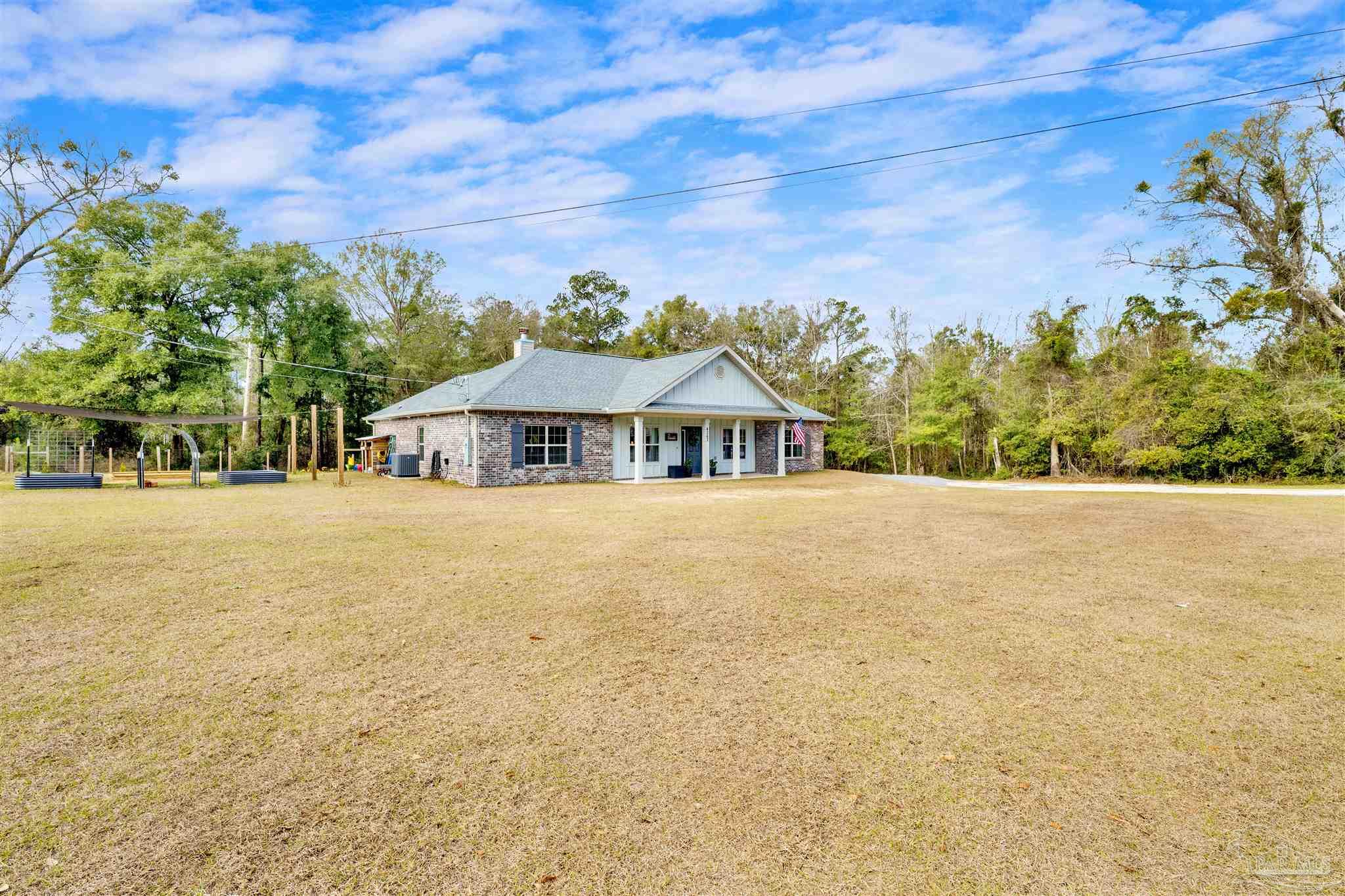 4363 Morristown Road Jay, FL 32565 - Photo 35 of 37 a front view of a house with a yard