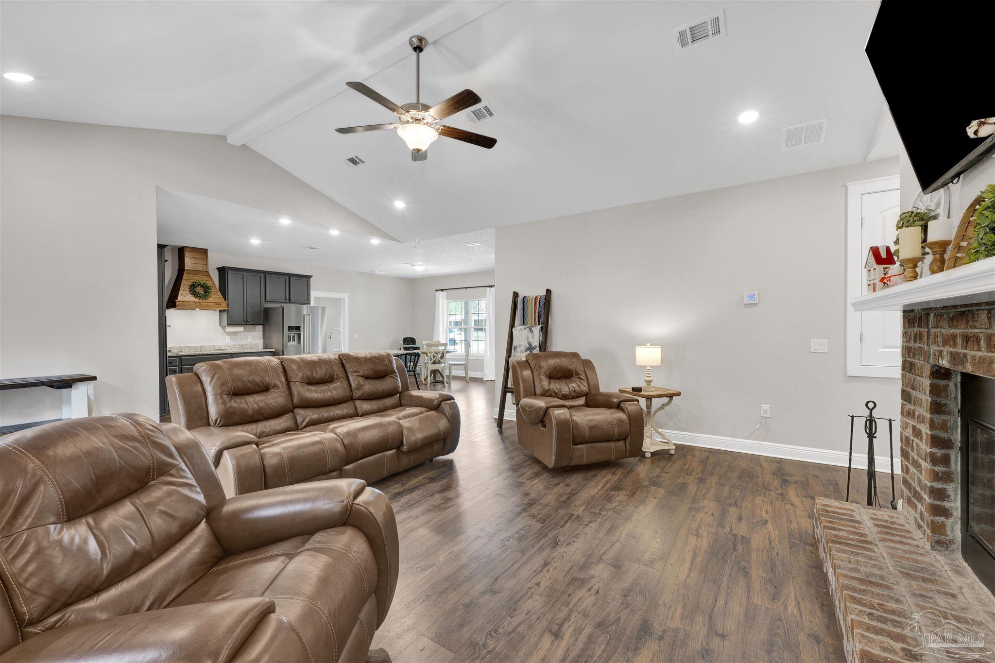 4363 Morristown Road Jay, FL 32565 - Photo 5 of 37 a living room with furniture and a flat screen tv