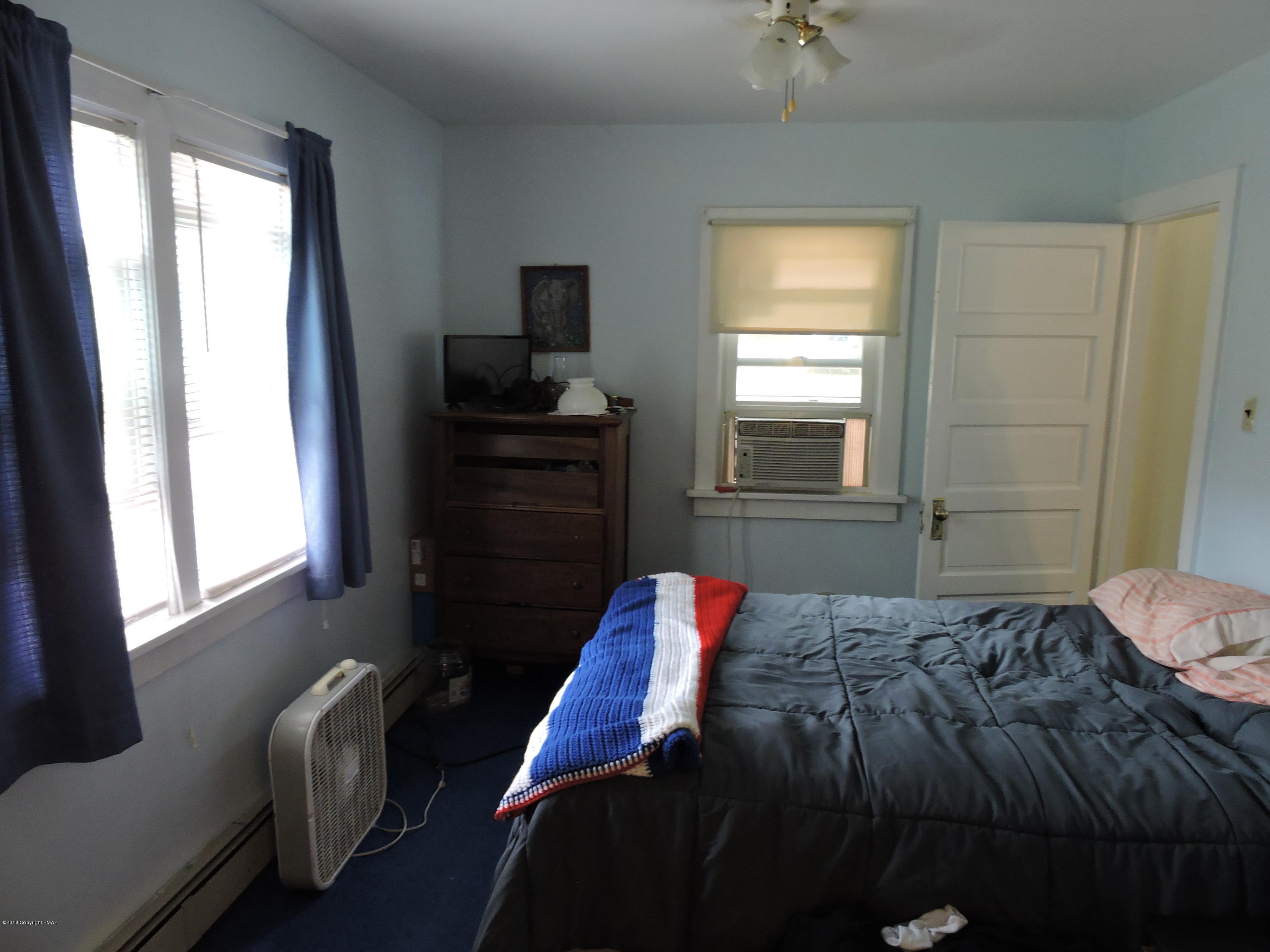 813 Stokes Mill Road Stroudsburg, PA 18360 - Photo 13 of 20 a bedroom with a bed and a window