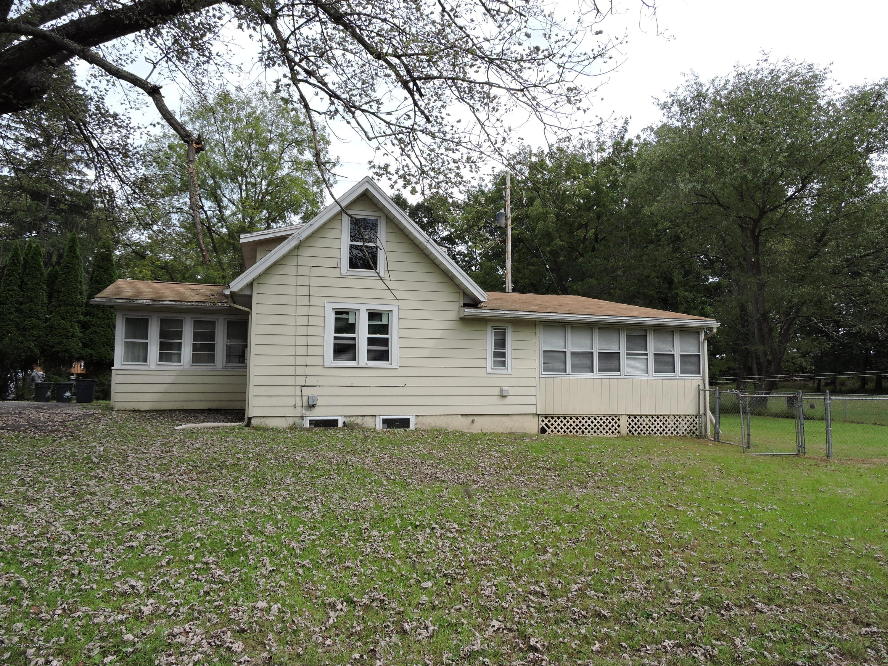 813 Stokes Mill Road Stroudsburg, PA 18360 - Photo 3 of 20 a view of a house with a yard