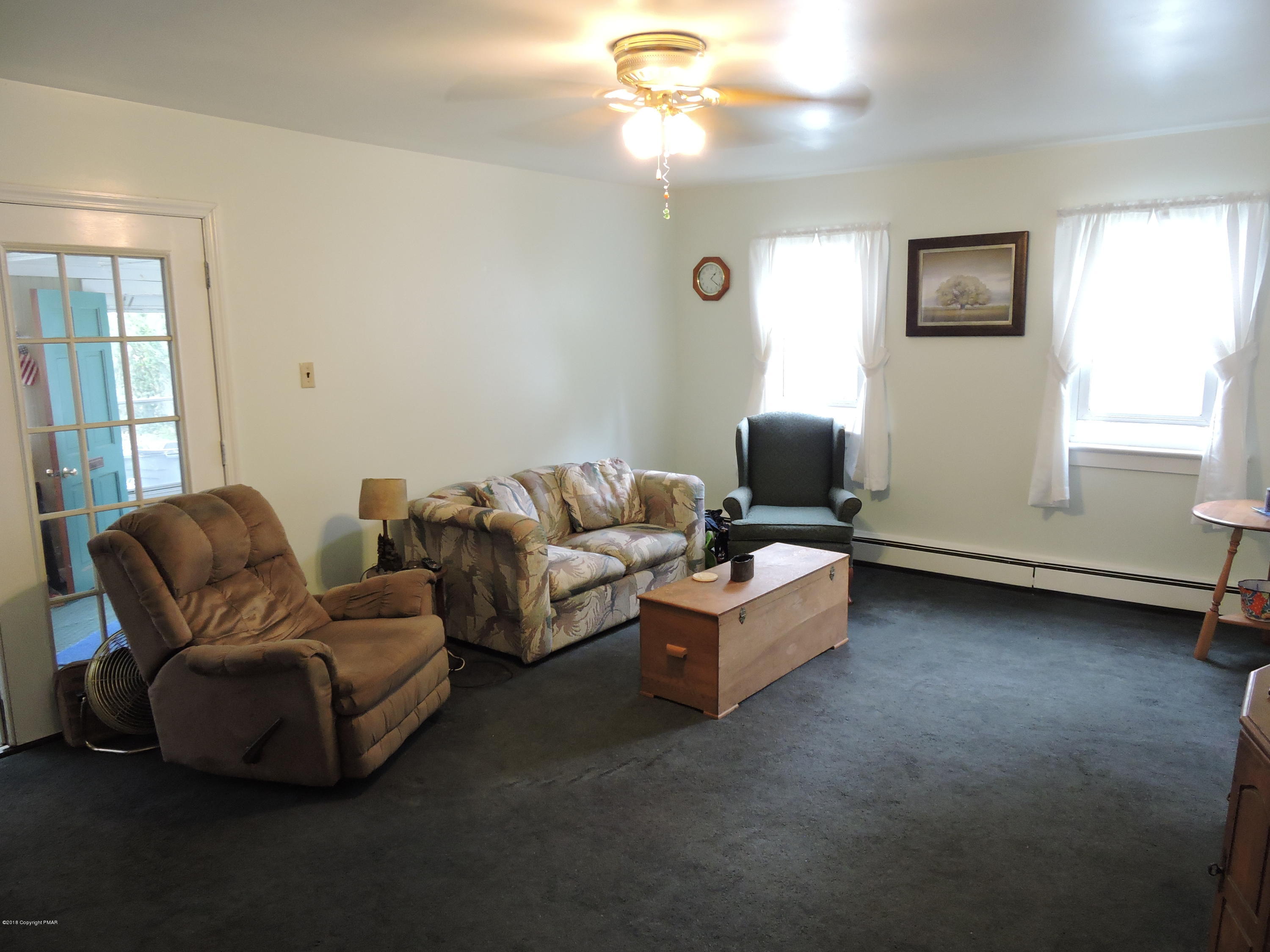 813 Stokes Mill Road Stroudsburg, PA 18360 - Photo 6 of 20 a living room with furniture and a window