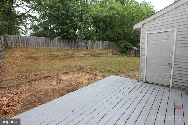 a view of a house with a door and wooden floor