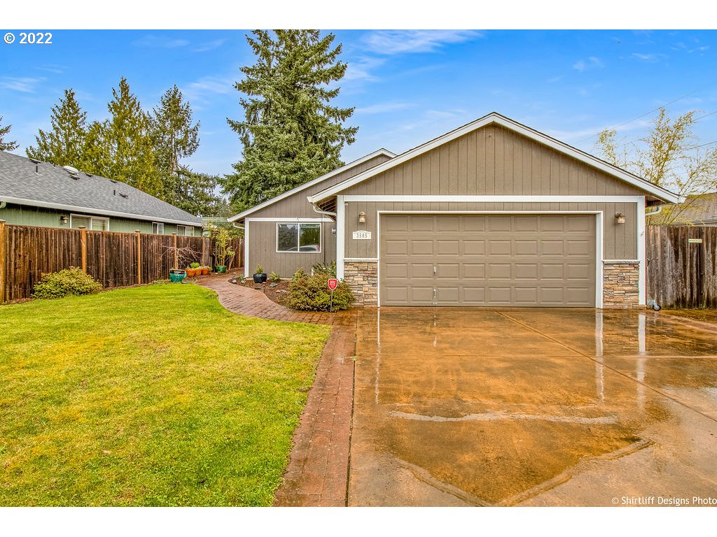3565 Castrey Street Eugene, OR 97404 - Photo 2 of 30 a backyard of a house with table and chairs