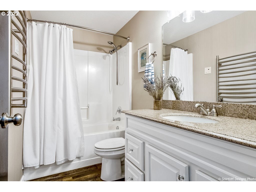 3565 Castrey Street Eugene, OR 97404 - Photo 25 of 30 a bathroom with a granite countertop sink toilet and shower