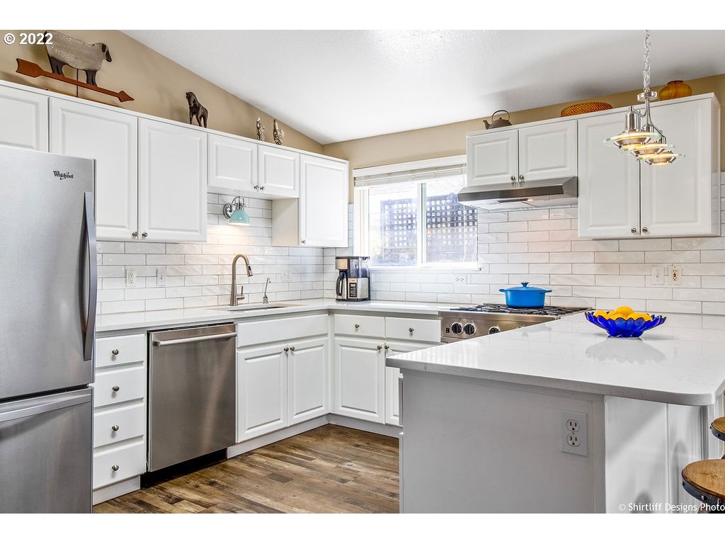 3565 Castrey Street Eugene, OR 97404 - Photo 9 of 30 a kitchen with a sink cabinets and window