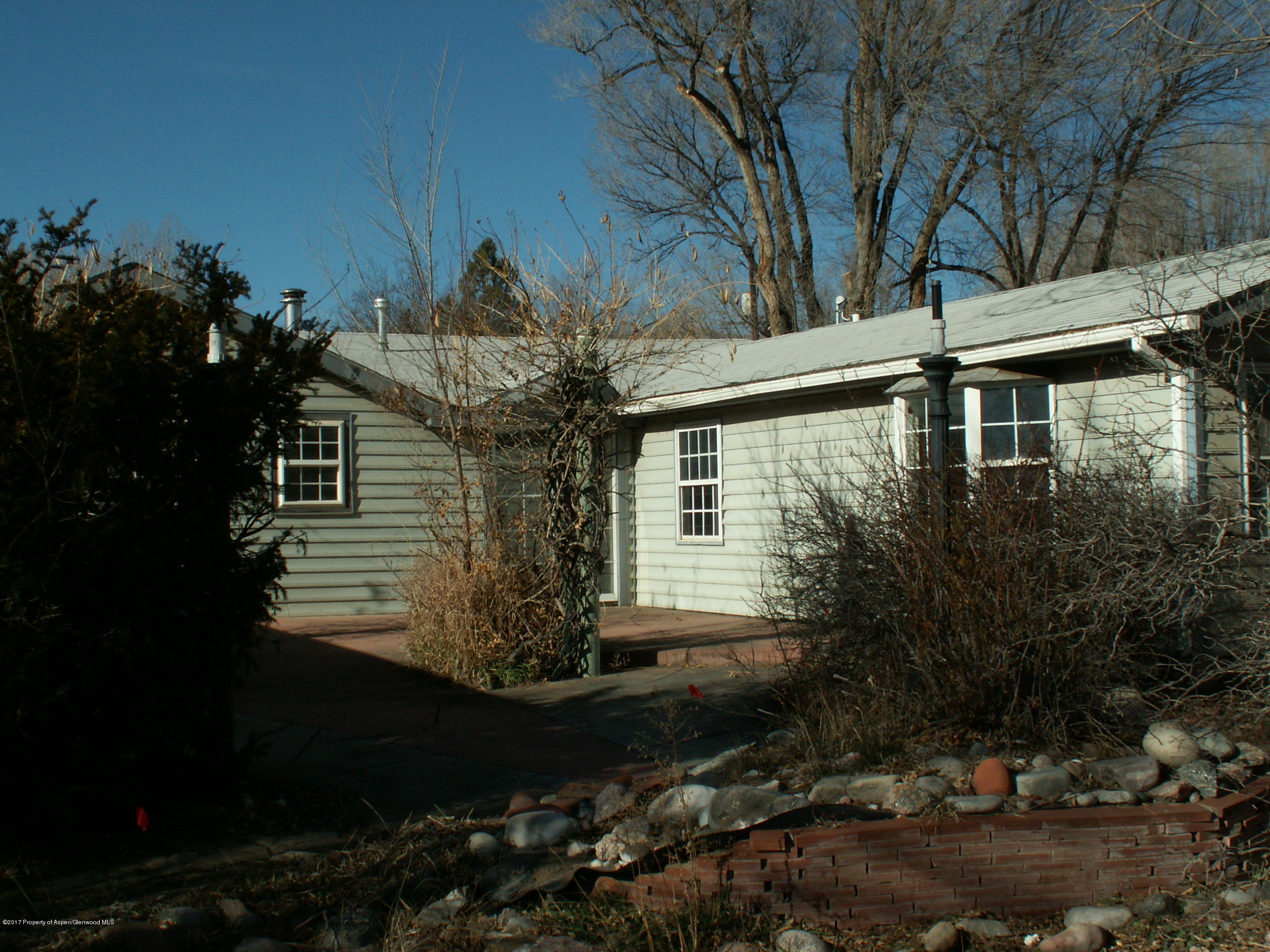 826 Randolph Avenue Rifle, CO 81650 - Photo 3 of 21 a view of a house with a yard